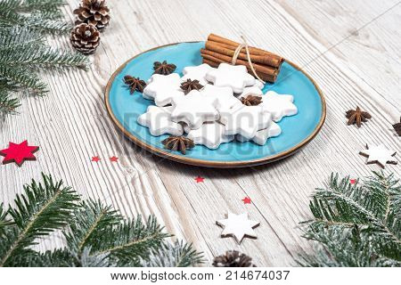 Christmas plate with cakes. background on the wooden desk