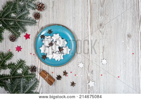 Christmas plate with cakes. background on the wooden desk