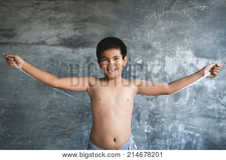 Portrait Asian fat boy concept healthy and lose weight selective and soft focus