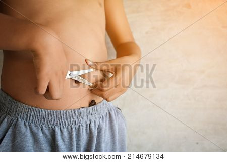 Portrait Asian fat boy concept healthy and lose weight selective and soft focus