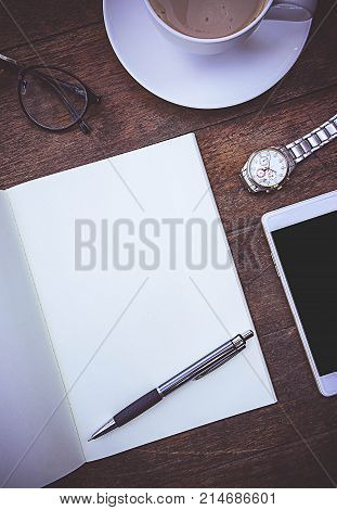 Blank Paper Book On the wood working table Warm coffee Wait for creative time to start papeer blank for text background