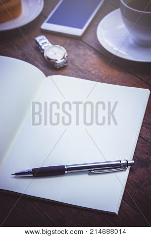 Blank Paper Book On the wood working table Warm coffee Wait for creative time to start papeer blank for text background