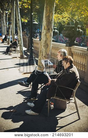 Panish Senior Couple Reading La Vanguardia