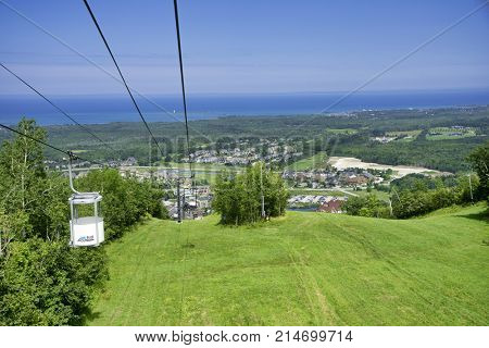 COLLINGWOOD, ON, CANADA - JULY 20, 2017: View of gondola chairlift on top of Blue Mountain Ski Resort during summer time
