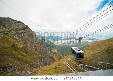 KUZNICE POLAND-SEPTEMBER 18: Cable car carries passengers from Kuznice to Kasprowy Wierch peak on Septomer 18 2017 in Zakopane Poland. This cable car built in 1936 was the first of its kind in Poland
