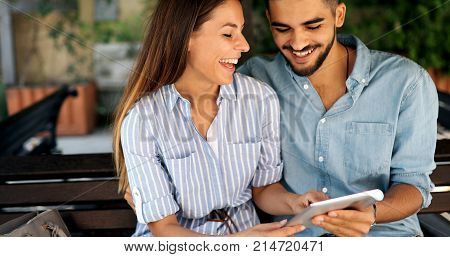Happy young couple doing shopping on internet