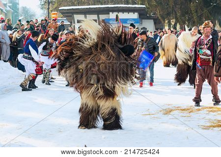 Razlog, Bulgaria - January 14, 2017: People in traditional carnival kuker costumes at Kukeri festival Starchevata