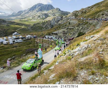 Col de la Croix de Fer France - 25 July 2015: Teisseire caravan driving on the road to the Col de la Croix de Fer in Alps during the stage 20 of Le Tour de France 2015. Teisseire produces fruit juices and syrups for the food service industry.
