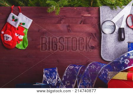 Package Christmas Gift Box. New Year Christmas Wrapping Paper, Ribbon, Bow And Thread, Scissors, Chr