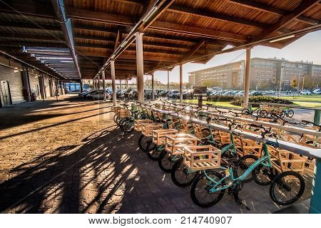 bike parking at sunset outside Fico Eataly World in Bologna Italy 19 Nov 2017