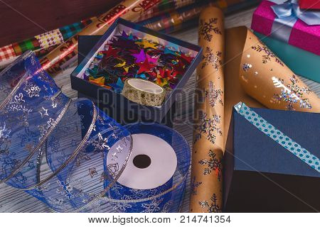Package Christmas Gift Box. New Year Christmas Wrapping Paper, Ribbon, Bow And Thread, Scissors, Chr