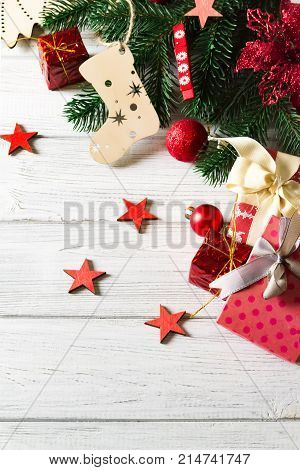 beautiful christmas background with gift boxes balls christmas ornaments and christmas tree branches copy space