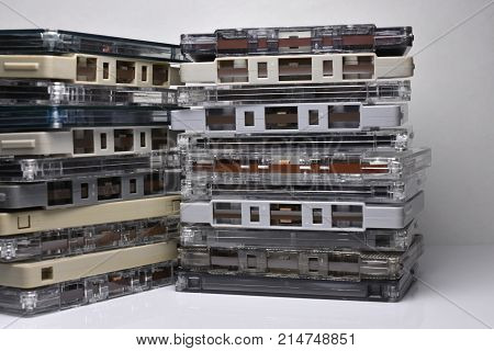 Vintage cassette tape stacked vertical white background.