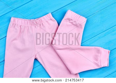 Trendy pink trousers for little girls. Soft natural leggings for infant girls, new collection. Stylish cothes for kids.