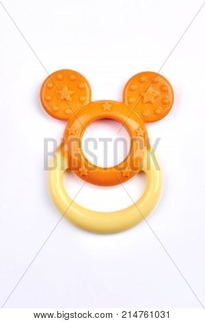 Orange color baby teether isolated. Cute teether for babies isolated on white background. Newborn teter toy on sale.