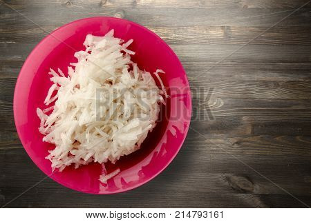 Daikon On A Wooden Background