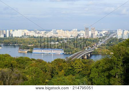 Bridge ship houseboat in the background of the city of Kiev.