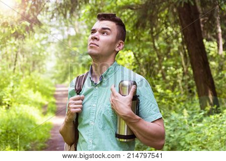 A man walks in the woods. A traveler a tourist. Summer. Autumn.
