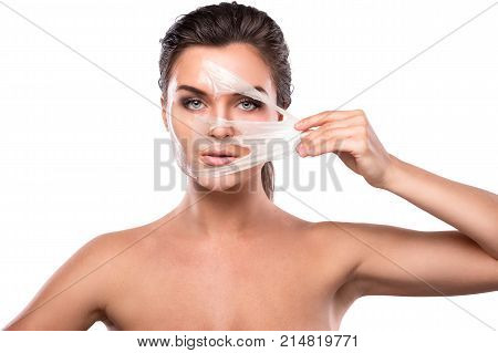 Young Woman With Purifying Mask On Her Face