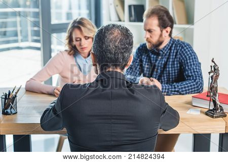 Couple Having Meeting With Lawyer