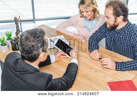 Couple Having Meeting With Lawyer