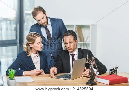Lawyers With Laptop In Office