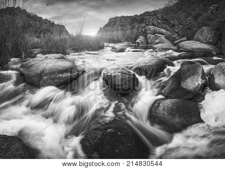 Canyon With Fast Rocky River. Monochrome Colors