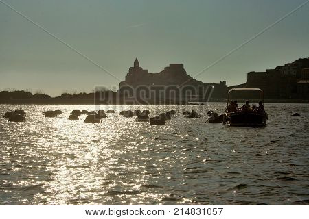 Fishing boats in the afternoon in front of Portovenere