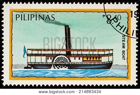 Moscow Russia - November 21 2017: A stamp printed in Philippines shows old steamboat with paddle wheel series "Water Transport" circa 1984