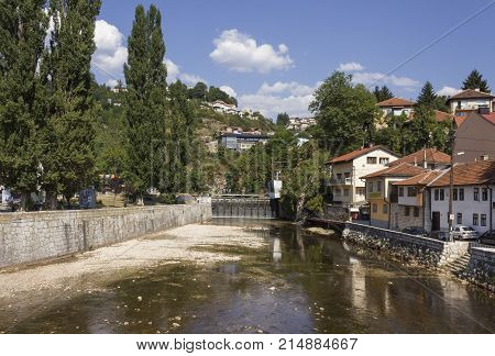 SARAJEVO, BOSNIA-HERZEGOVINA - AUGUST 18 2017: Miljacka river in Sarajevo in summer season