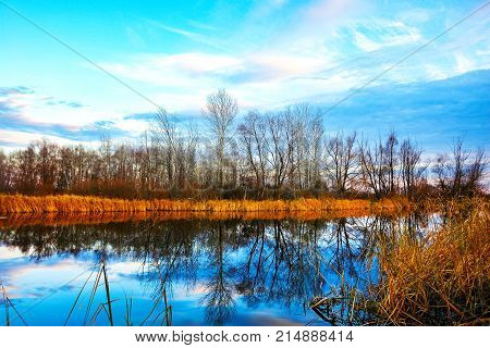 Late fall. Autumn landscape on the lake.