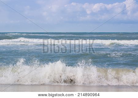 Sea Coast Waves Rolling On Sandy Beach, Cloudy Sunrise