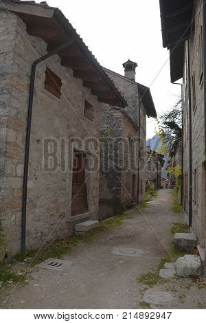 A small street in the hill village of Erto in Friuli Venezia Giulia north east Italy. The village is famous locally for having being evacuated following the 1963 Vajont Dam disaster.