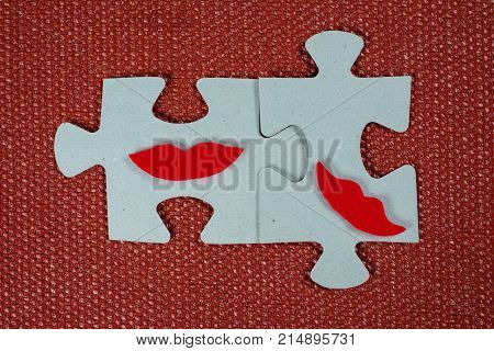 Close-up Of Two Parts Of A Puzzle. Symbolic Women With Lips. The Concept Of Psychological Compatibil