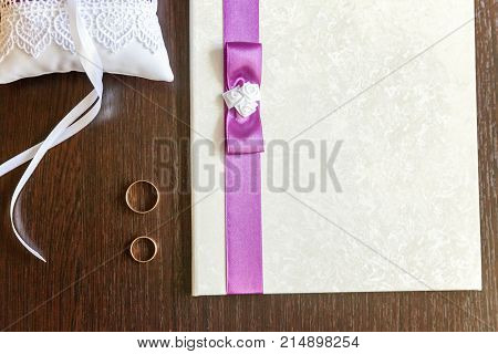 wedding accessories and rings close up on wooden background