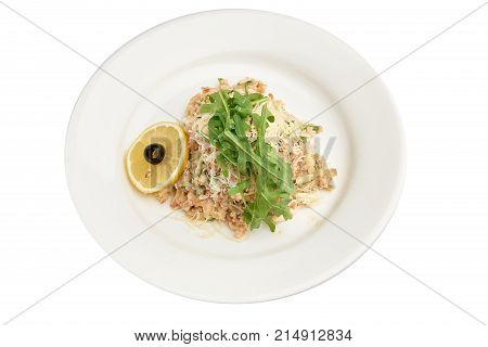 Kinoa on a plate on a white background isolation