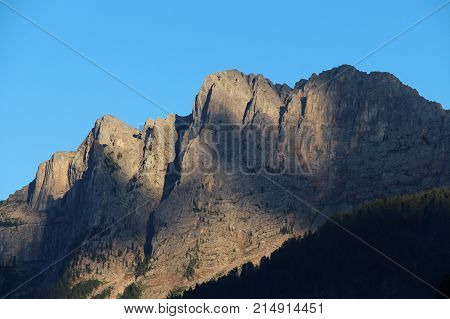 The view of mountain massif at sunset light.