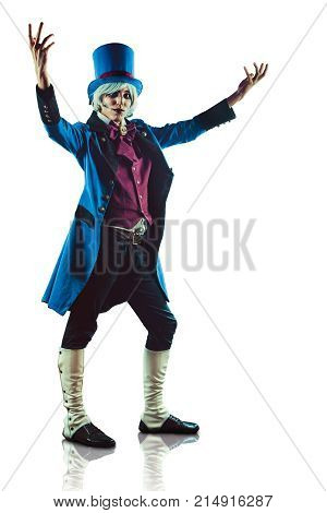 Smiling circus actor in blue tuxedo is presenting something. Isolated on white.