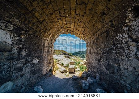 Old archway tunnel through old fortification wall.