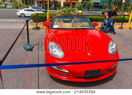 Las Vegas, United States of America - May 05, 2016: Luxurious and Colorful Cars for Rent Waiting in the Parking Lot of a Supermarket on the Las Vagas Strip, Nevada on May 05, 2016