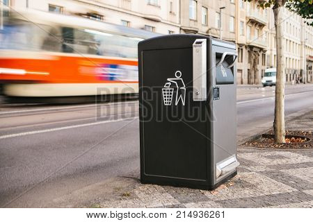 A modern clever trash can on the street in Prague in the Czech Republic. Collection of waste in Europe for subsequent disposal. Eco-friendly waste collection