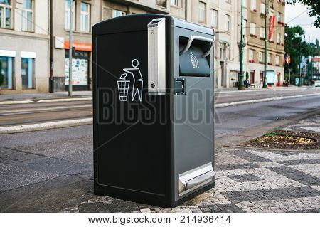 A modern clever trash can on the street in Prague in the Czech Republic. Collection of waste in Europe for subsequent disposal. Eco-friendly waste collection
