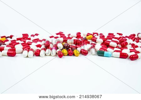 Selective focus of antibiotic capsules pills on white background. Drug resistance concept. Antibiotics drug use with reasonable and global healthcare concept.