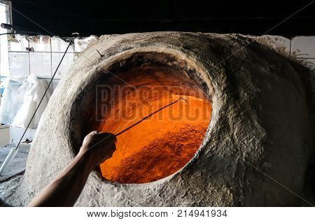 Baking the bread in tandoor at Manama Bahrain