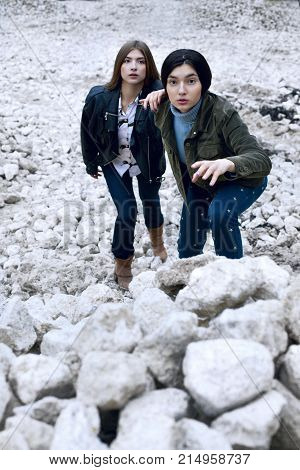 Two Pretty Girl Shoked Beacause See Something On Surface Of Moon. Surreal Image