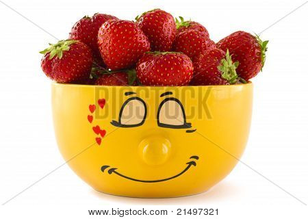 A Yellow Cup With Strawberries