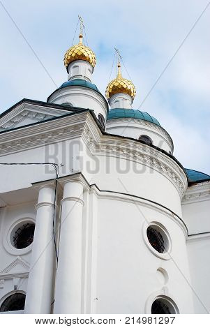 Monastery of the Epiphany in Uglich, Russia. Women's monastery. New Epiphany cathedral. Blue sky with clouds background.