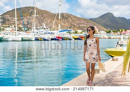 Woman tourist walking in Philipsburg harbor, St Maarten, popular port of call for cruise ship travel destination. Netherlands Antilles.