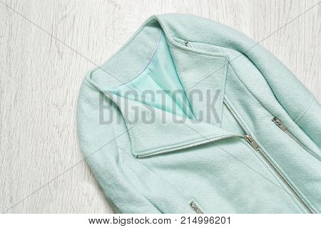 The mint colored womans jacket. Fashionable concept