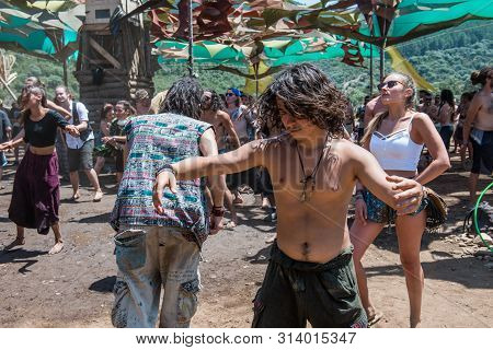 Riomalo De Abajo, Extremadura, Spain - July 13, 2018: A Young Boy Dances Uninhibited On The Main Sta
